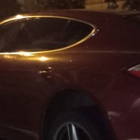 Porsche on trailer at night
